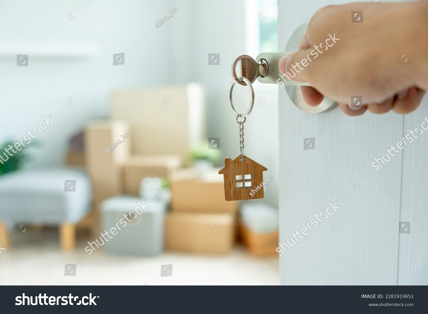 stock-photo-moving-house-relocation-the-key-was-inserted-into-the-door-of-the-new-house-inside-the-r
